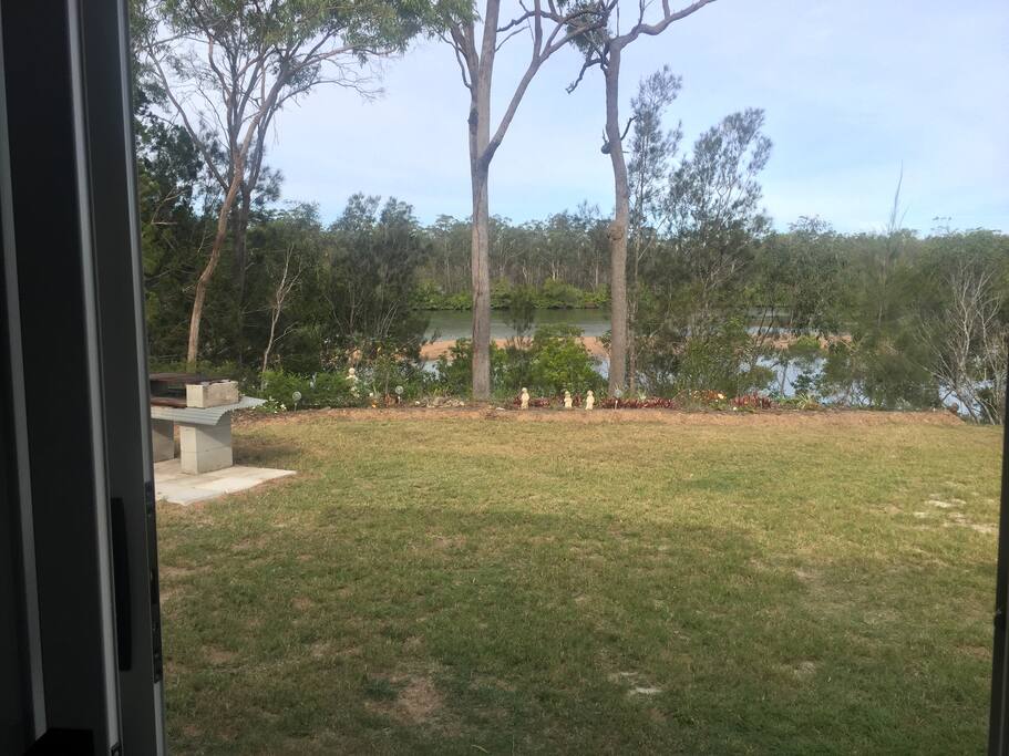 Looking out the glass sliding doors to the river.