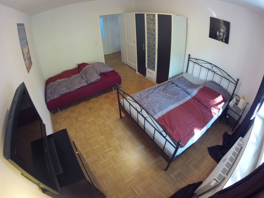 Bright Private Room with Sleeping Couch, TV and key for door.