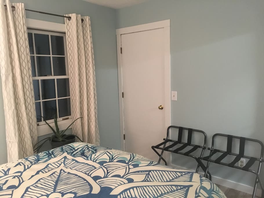 Closet and plenty of light with two windows in the room