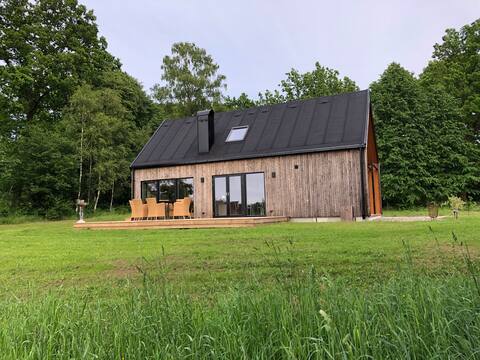 Newly built cottage in the woods near lake