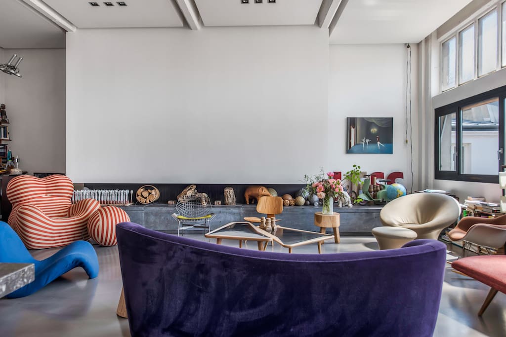 Highly fashionable living room with couch, sofas and armchairs