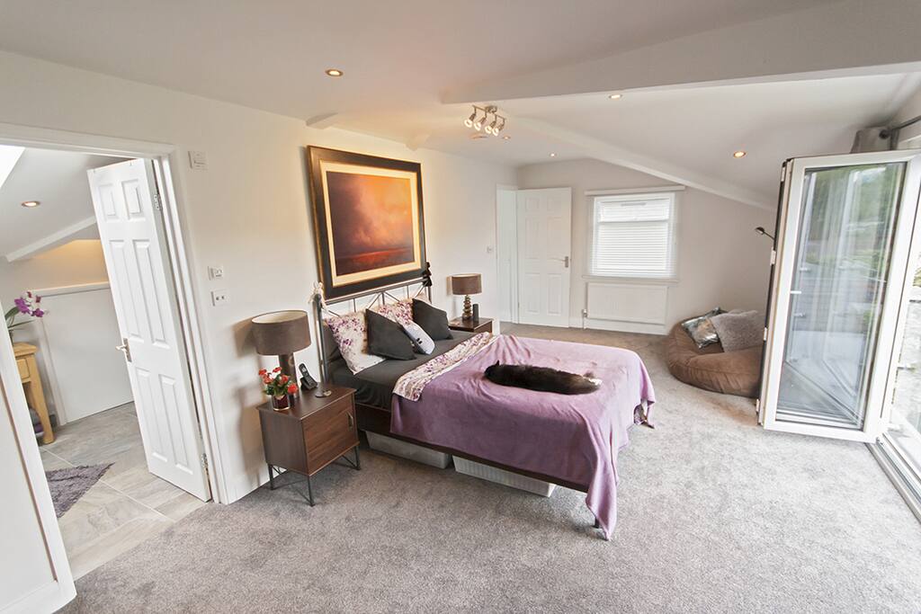 View towards room entrance. Ensuite door to left, Juliet balcony to right