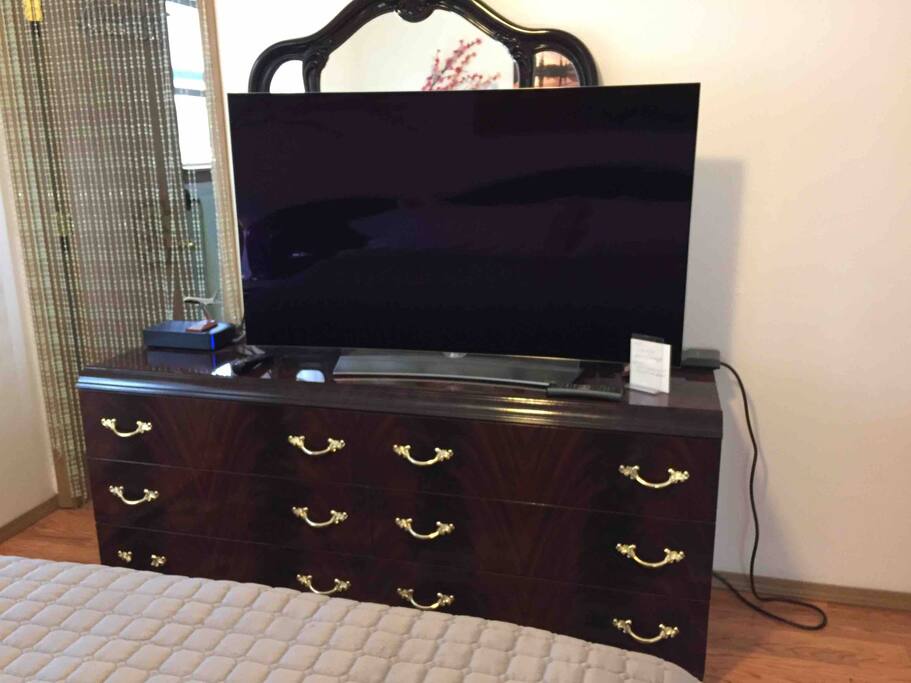 Curved 4K TV Oled and dresser,