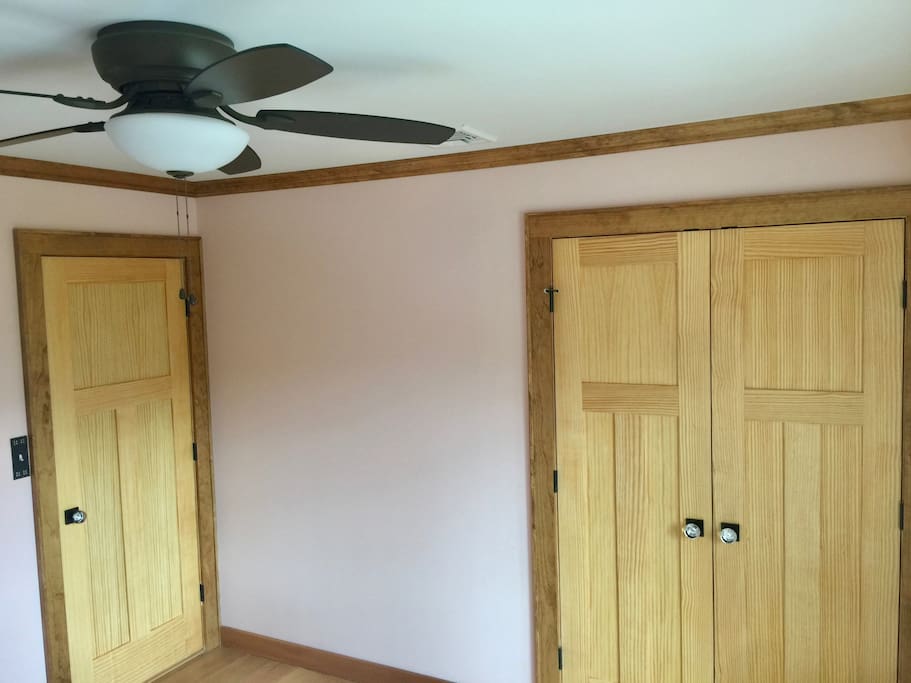 Picture 1 of 3 of bedroom. Double door closet, ceiling fan, and central ac vent shown