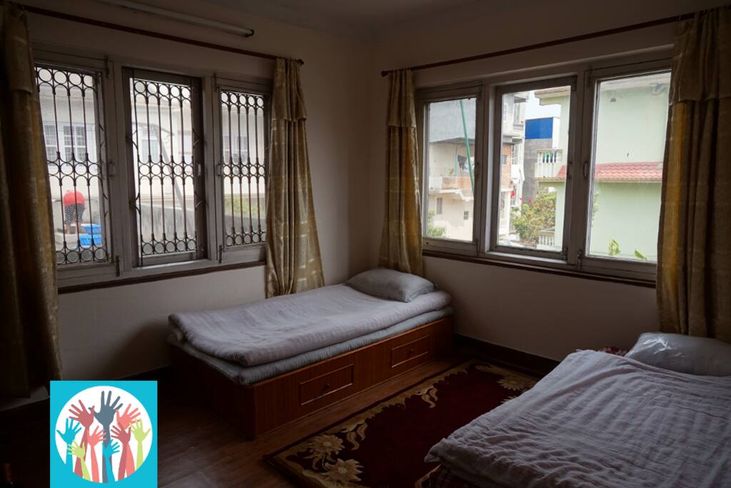 There are two single beds in each bedroom.