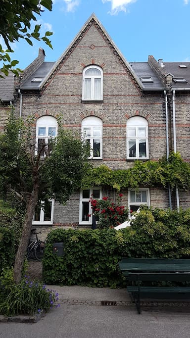 The house in the middle of the street.
