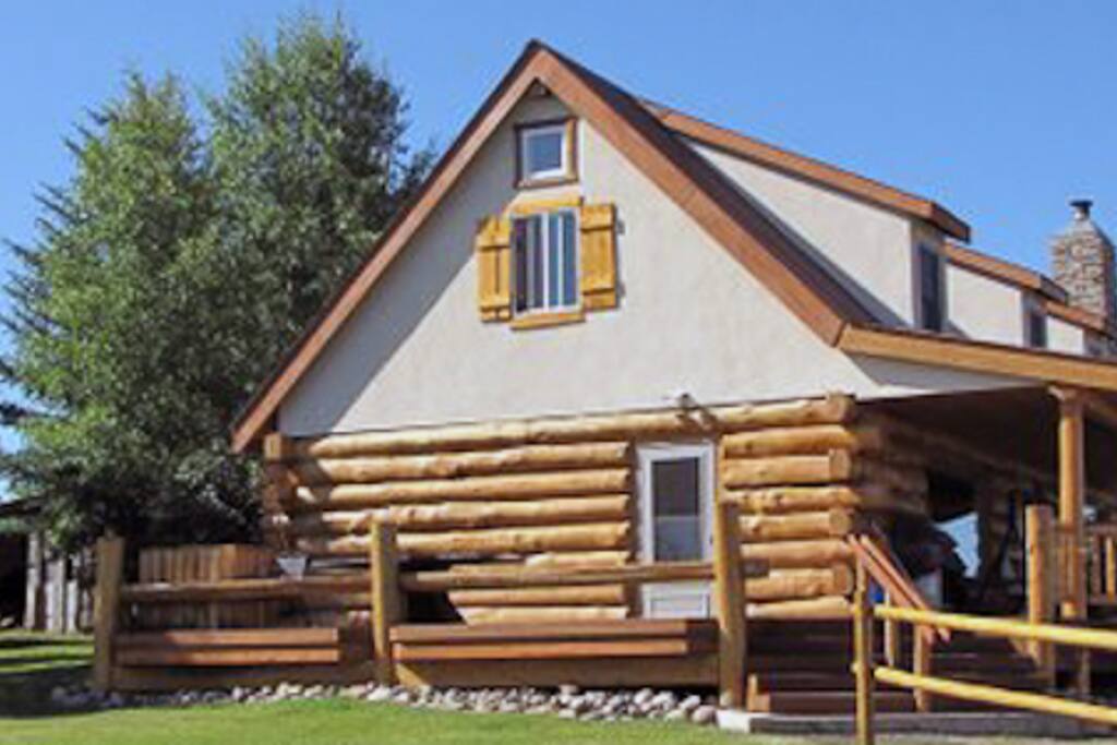 East side of the Lodge with large deck and log benches