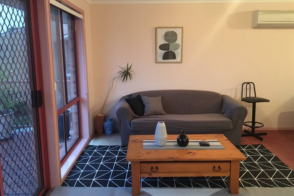 Large open plan lounge room with large balcony and outdoor setting.
2 Double Sofa Lounges. Reverse cycle heating and cooling.