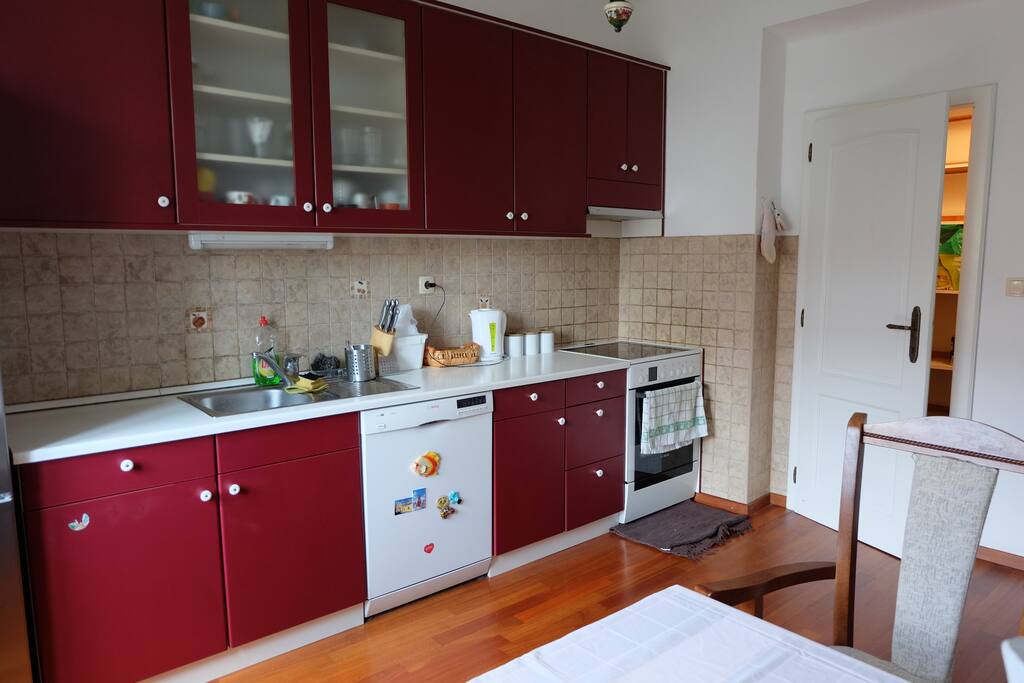 Spacey kitchen with a dinning table.