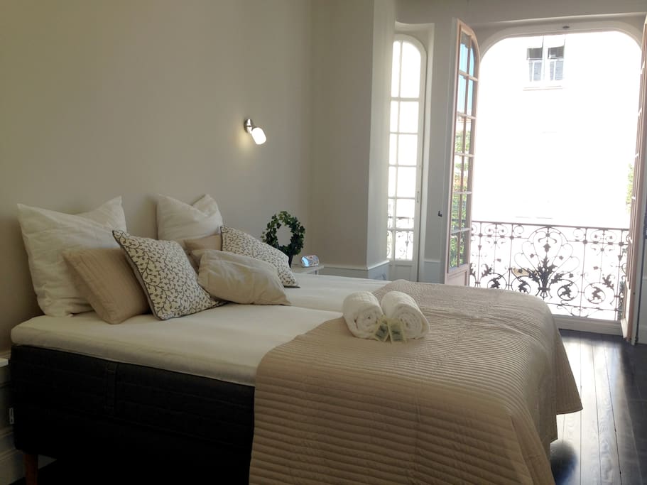 The first bedroom, situated just next to the kitchen has been finished with soft colours to create a calm yet luxurious feel. There is two single beds that can be converted onto one king size bed with bedside tables and reading lamps either side, large wardrobes complete this beatiful bedroom.