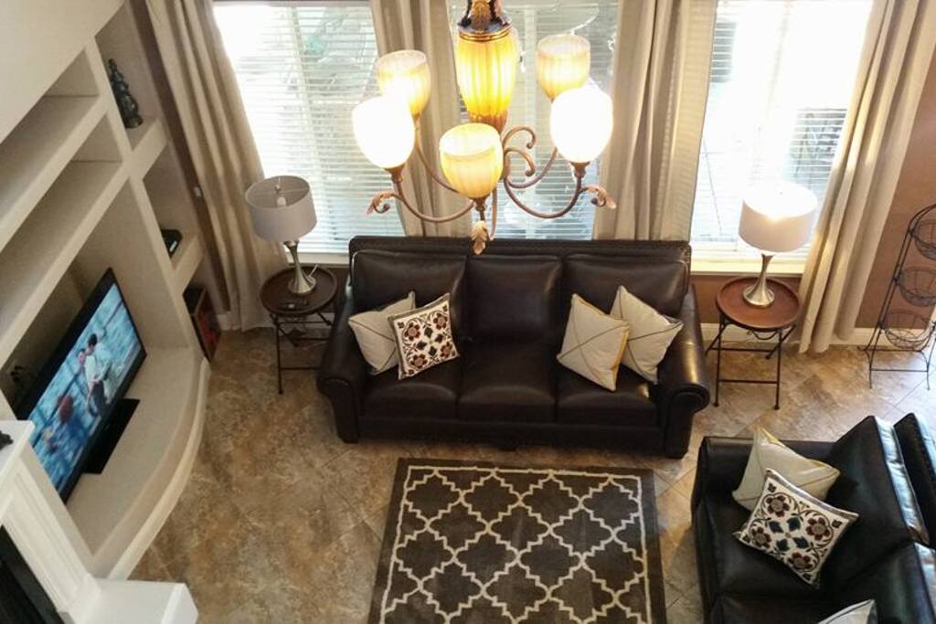 Open Concept Living Room with fireplace, 55'' Smart Plasma TV and Top Grain Leather Sofas