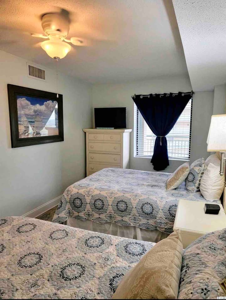 3rd bedroom with 2 full beds and access to a full bath
