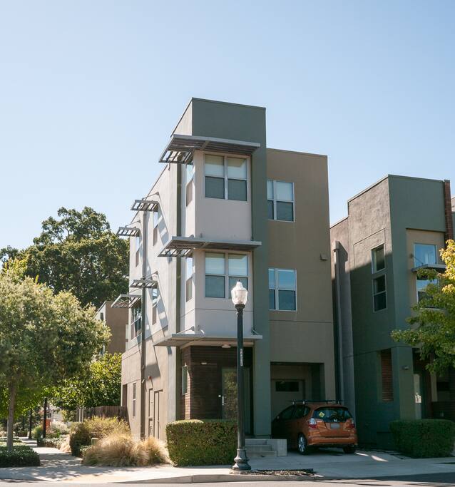3-stories with lots of windows. Driveway parking spot, plus plenty of on-street parking