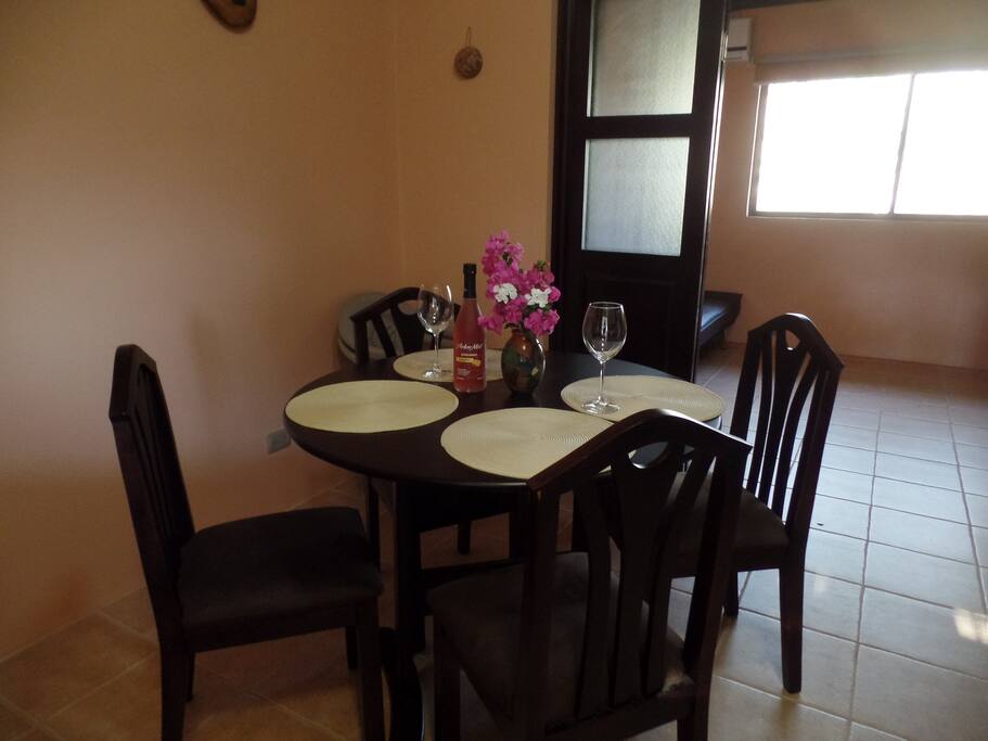 Eating area with French doors to bedroom shown in the background,