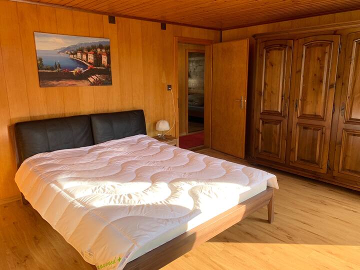 private bedroom with queensize bed