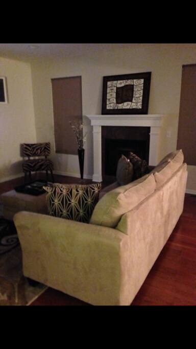 Living room with fireplace and flat screen TV