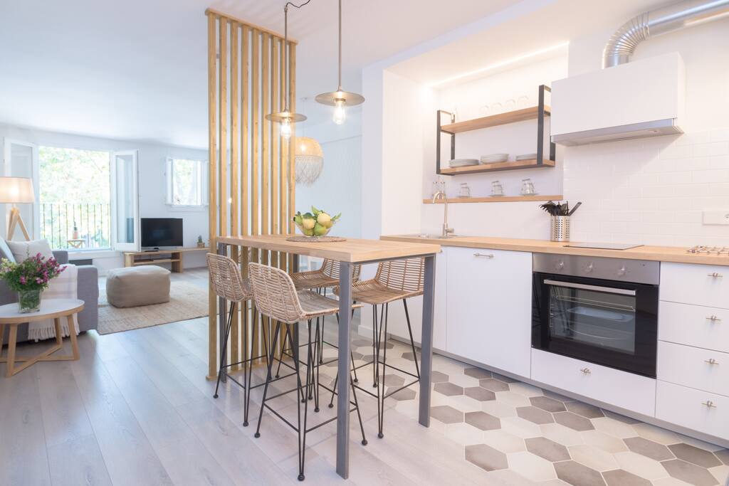 The open plan kitchen is full equipped
