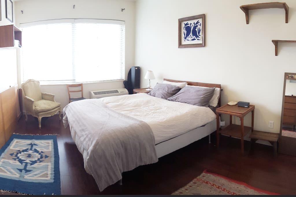 Spacious and bright bedroom with a memory foam queen size bed.