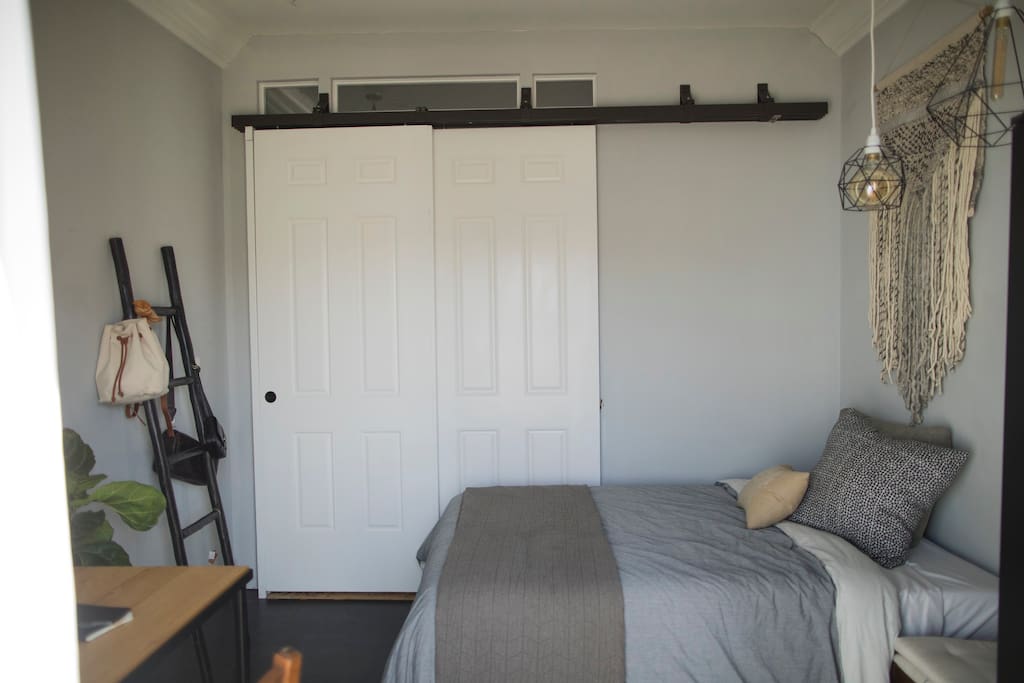Guest room with sliding barn door.
