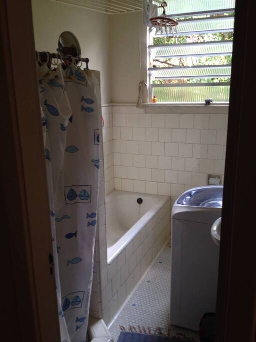 Old subway tiled bathroom shows the history of this charming apartment.