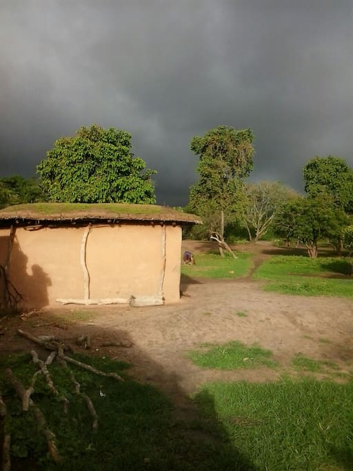 One of our huts with a rainstorm brewing in the distance