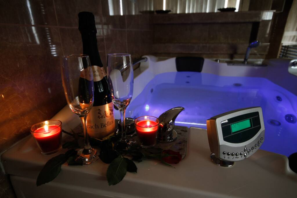 The Double Spa Jacuzzi Bath is the centrepiece of the Apartment - Sit Back & Relax