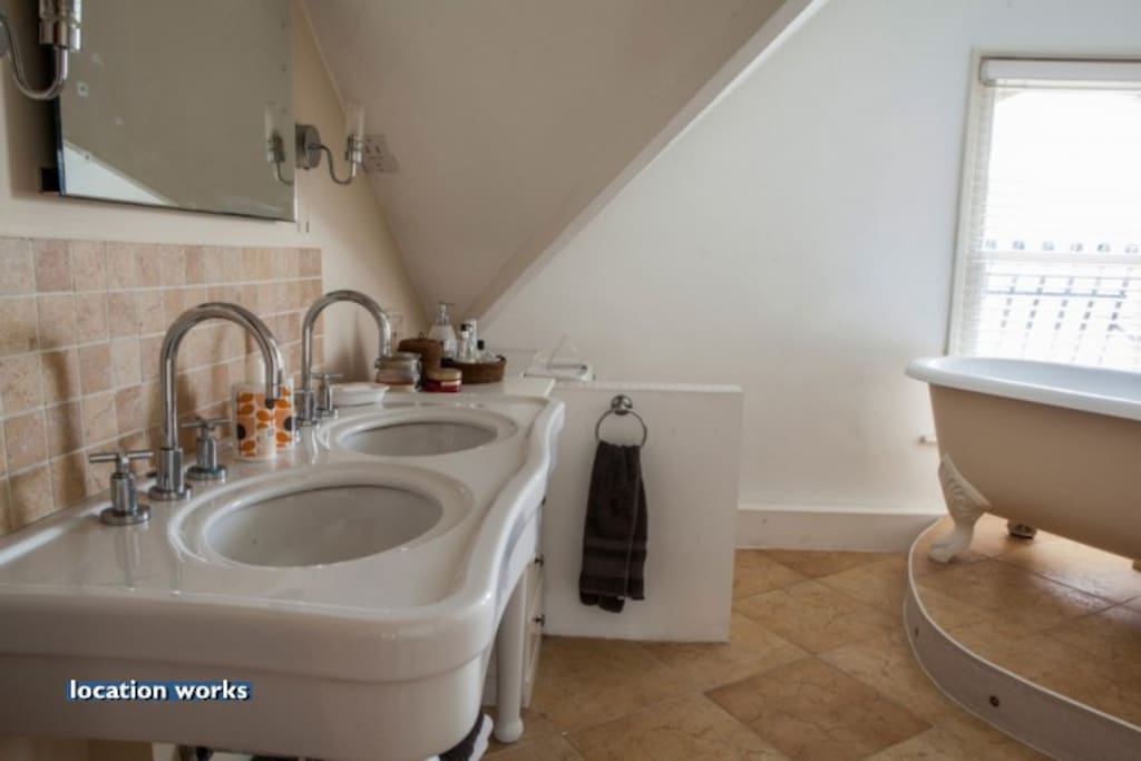 Large private bathroom with free-standing bath