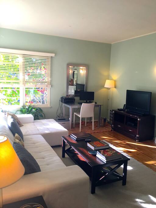 Comfortable light filled living room with reading nook