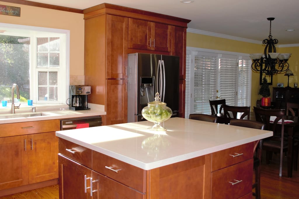 Newly, remodeled kitchen with quartz counter tops .Enjoy cooking while catching the afternoon sunshine in this kitchen.