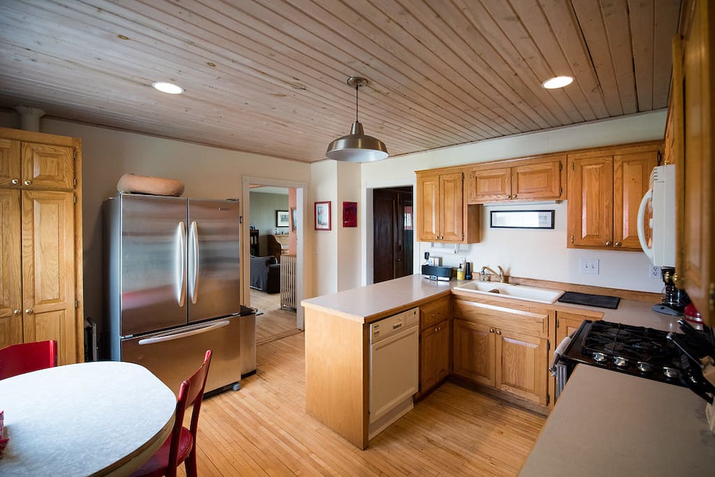 Fully equipped kitchen with oversized refrigerator, dual fuel JennAir stove, convection microhood and Miele dishwasher.