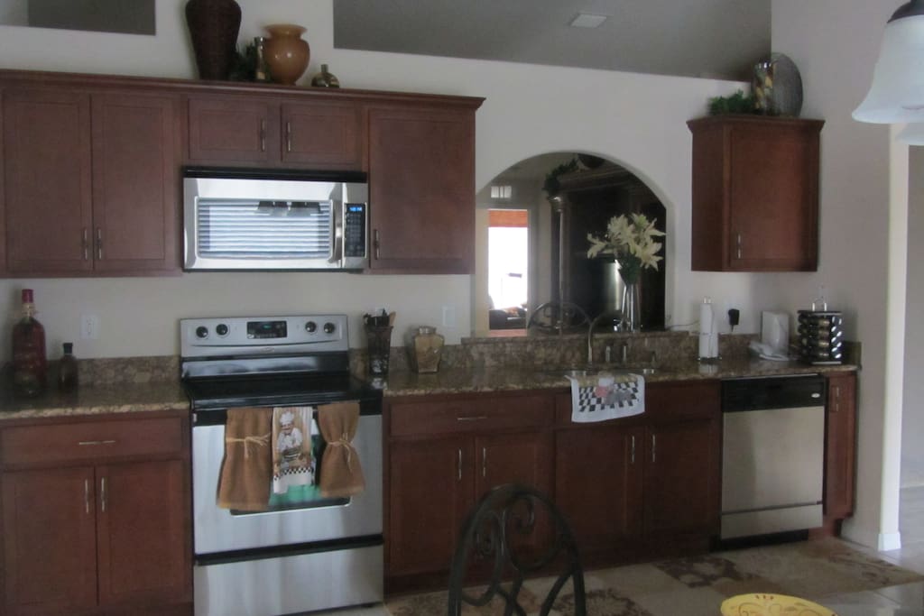Kitchen with pots and pans, dishes, basically just about anything you need.