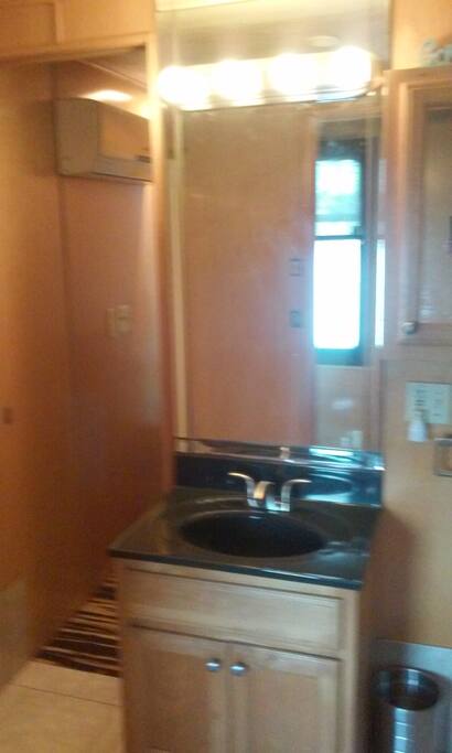 Shared bathroom with vanity