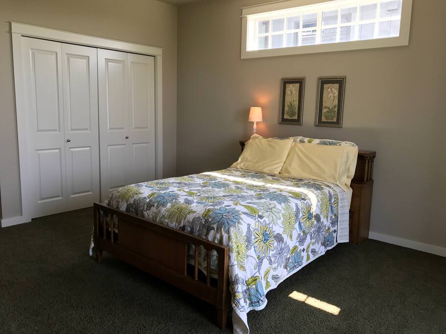 This is our lovely "Sunshine & Nature" guest room. It is a particularly spacious room, with a charming antique bed, though the full-size mattress is brand-new and super comfy! Our "Sunshine" guest room gets good natural light with the decor to match that natural feeling.
