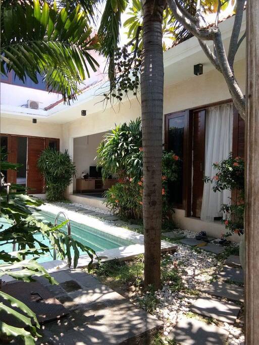 Open living space with pool view.