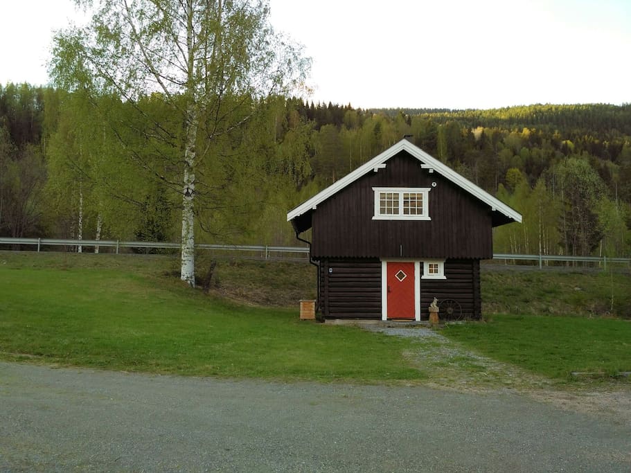 the log cabin, road behind