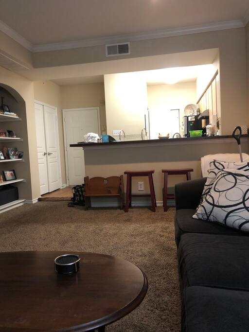 View from living room of Kitchen, front door, and laundry doors