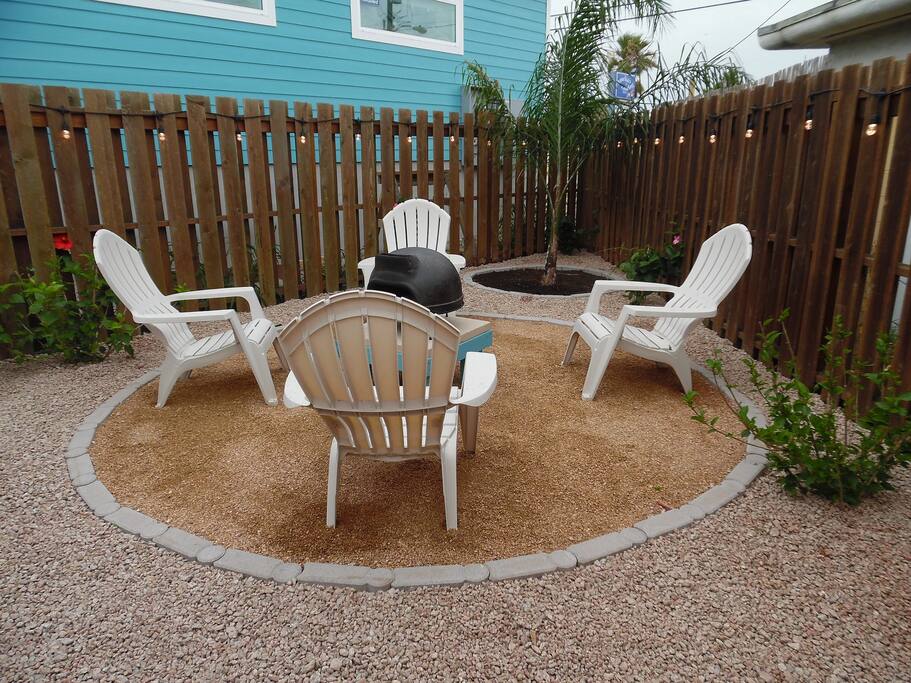 Fenced and lighted side yard for family and friends to gather
