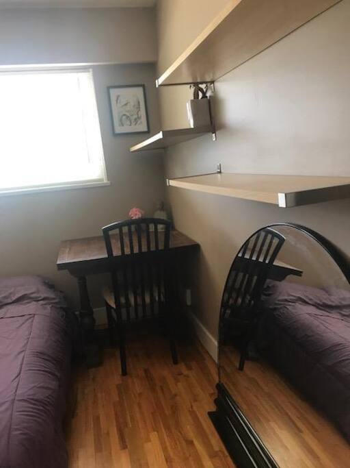 Your room has a beautiful expandable oak table for working & build in shelves for you to use.