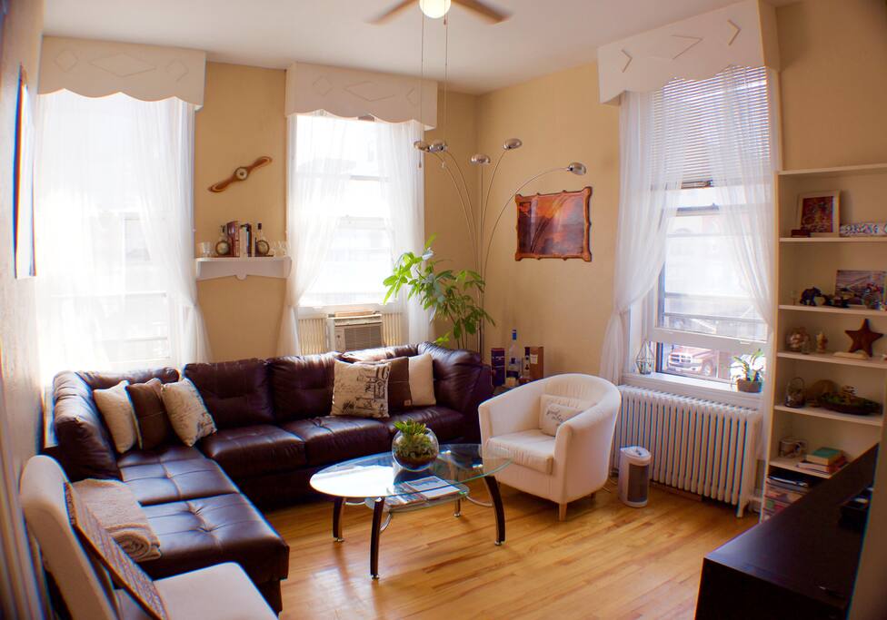 The cigar lounge inspired, open living room offers lots of natural light with big windows, high ceilings and big comfy seating to relax in with your favourite beverage after a long day on the road or exploring the downtown scene right on your doorstep. The bookshelf on the right features a variety of items from my travels, and of my interests, each item has a story behind it so if one catches your eye feel free to message me asking about it !