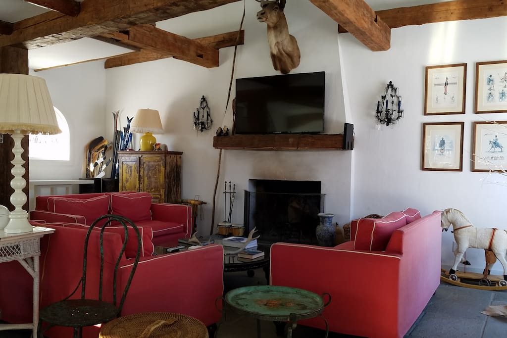 Guest House Family Room with slate floor and hand hewn beams