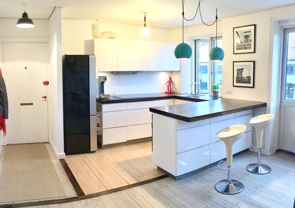 Fully equipped kitchen. Nice and open with bar chairs. A great place to hang out as the kitchen and the living room are combined.