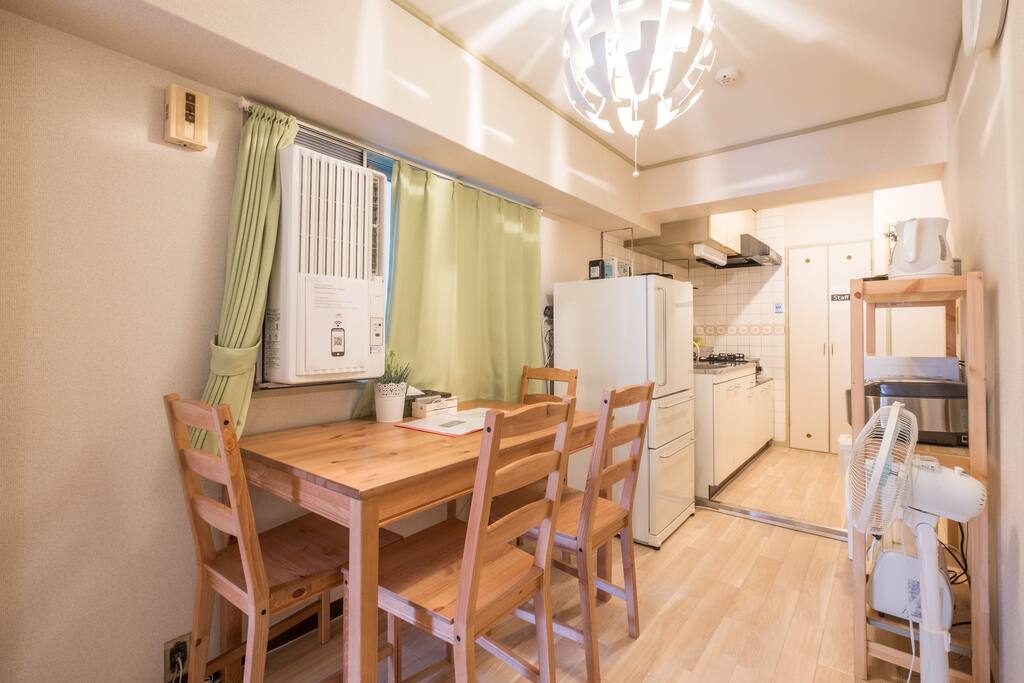 Living room: air conditioner, fan, heater, table & chairs