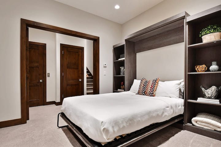 Queen sized murphy bed shown here open. Great space for kids or additional guests.