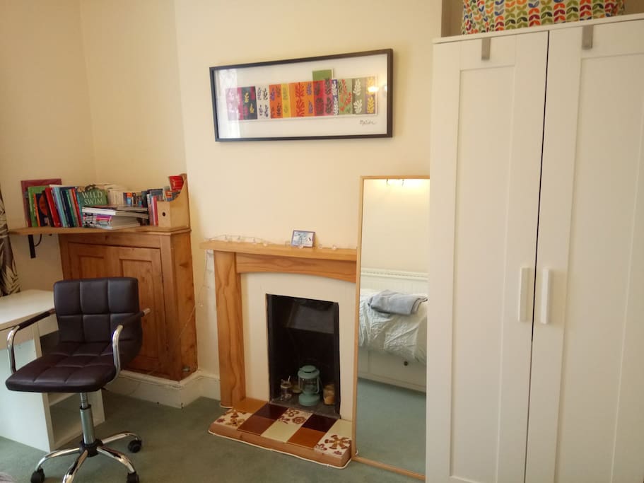 Desk and wardrobe, hanging space and shelves available here.