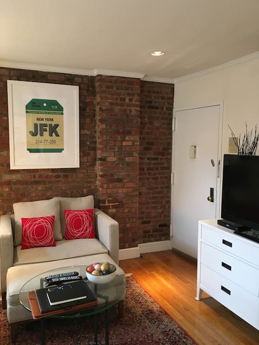 Living room (with couch, love seat and cable television)