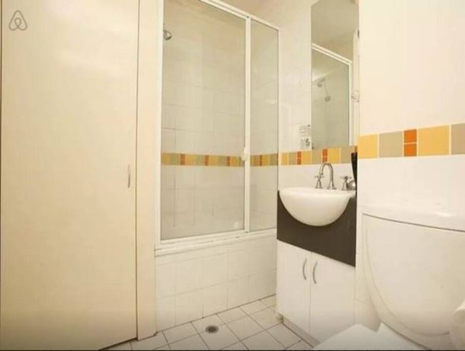 Bathroom with shower, basin and toilet