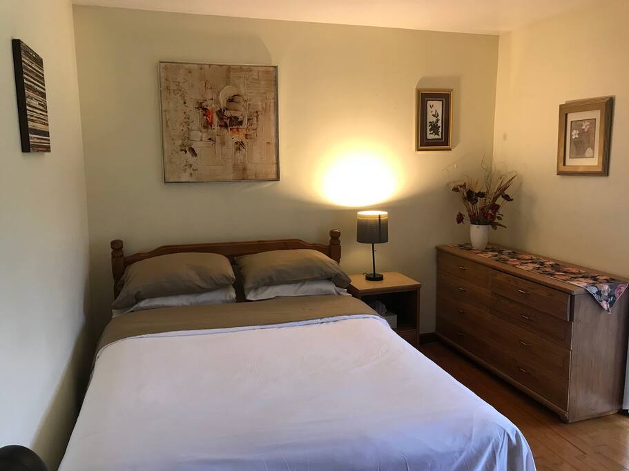 Queen bedroom with attached bath and breakfast table