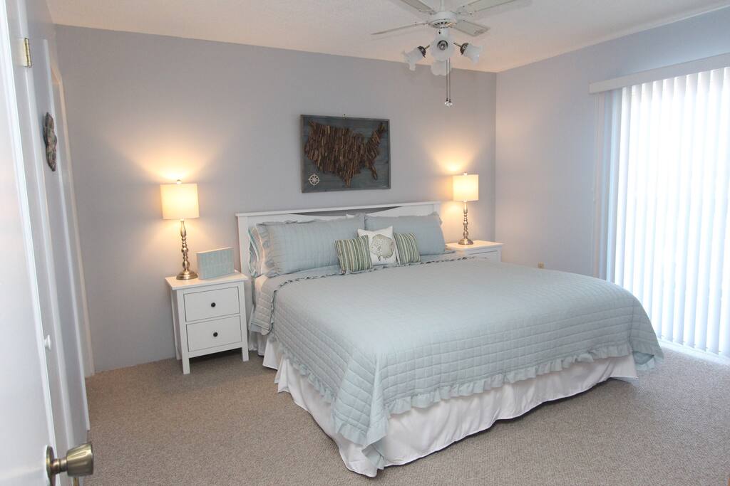 Master bedroom with King size bed and deck entrance.
