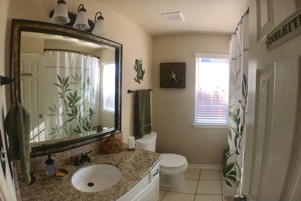 Elegant bathroom with plenty of towel and toiletry items space