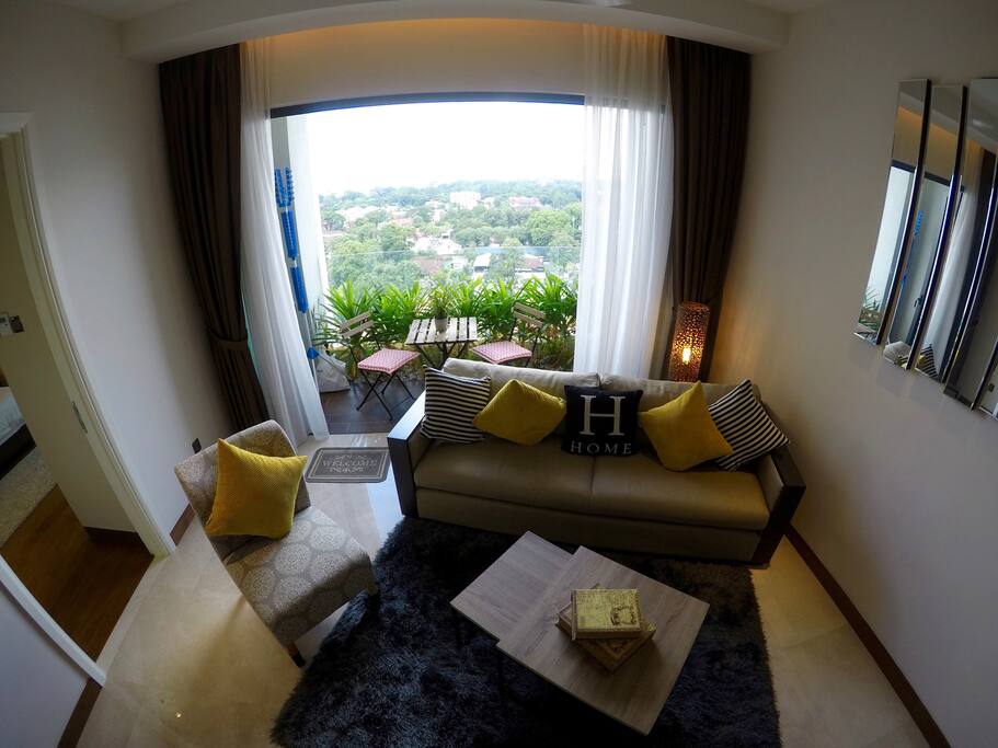 Living room which opens out to a balcony